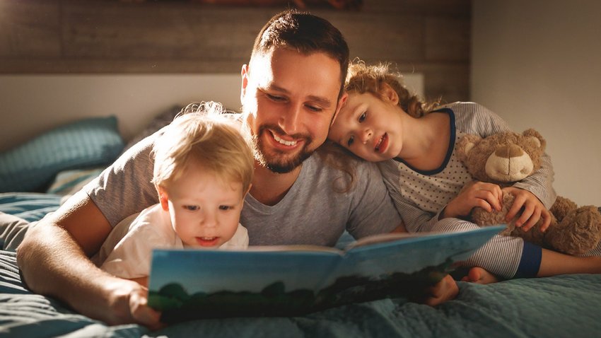 dad-reading-bedtime-story-to-kids.jpg